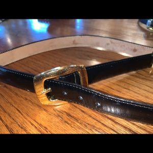 Gold chambered black belt.